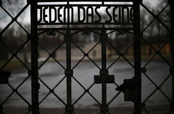 The camp gate with the inscription "to give each his due" is pictured at former concentration camp Buchenwald near Weimar