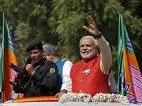 Modi, prime ministerial candidate for India's main opposition BJP, waves to his supporters in Vadodara