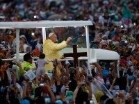 Pope Francis waves from the popemobile after leading a Mass at Rizal Park in Manila