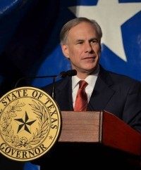 Gov Abbott with seal and Republican elephant