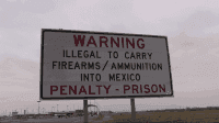 A sign warning U.S. citizens not to bring firearms into Mexico.