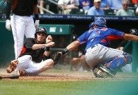 Christian Yelich, Travis d'Arnaud