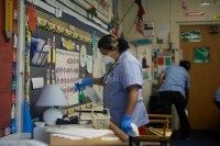Workers disinfect classroom inside Canyon Creek Elementary School in Texas