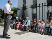 President Barack Obama stops to talk with visiting school children outside the West Wing of the White House, April 29, 2015. The President was returning from a walk with Shanna Peeples, the 2015 National Teacher of the Year, when he met the children and their chaperones.