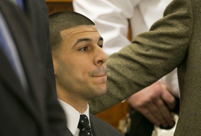 Former NFL player Aaron Hernandez listens as the guilty verdict is read during his murder trial at the Bristol County Superior Court in Fall River