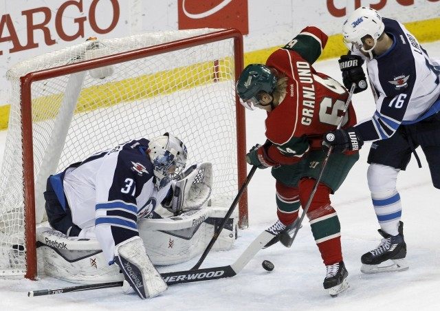 Ondrej Pavelec, Mikael Granlund, Andrew Ladd,