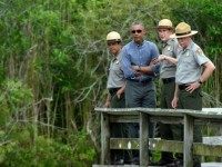 President Barack Obama walks the Anhinga Trail at Everglades National Park, Fla,, Wednesday, April 22, 2015. Obama visited the Everglades on Earth Day to talk about how global warming threatens the U.S. economy. He says rising sea levels are putting the "economic engine for the South Florida tourism industry" at risk.