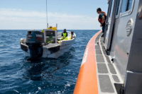 Coast Guardsmen from Station South Padre Island, Texas, catch and detain Mexican nationals aboard a lancha after crews in Coast Guard aircraft spotted them fishing illegally in U.S. territorial waters Friday, May 1, 2015. U.S. Coast Guard photo