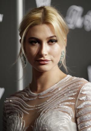 Hailey Baldwin debuts brunette hair at 2015 Met Gala