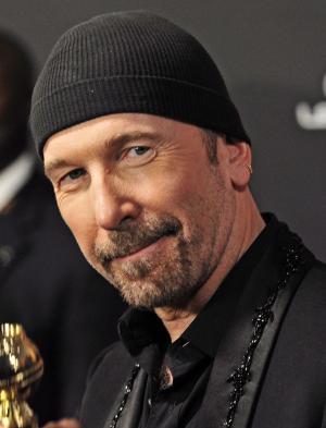 U2's The Edge falls off stage at concert