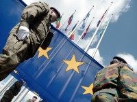 Soldiers of a Eurocorps detachment raise the European Union flag to mark the inaugural European Parliament session on June 30, 2014, in front of the European Parliament in Strasbourg, eastern France.