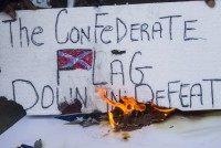 Activists In Los Angeles Gather To Burn Likenesses Of The Confederate Flag