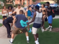 Two young men charge police officer as he attempts to detain teenage girl. (Photo: YouTube/Brandon Brooks)