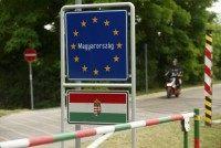 A motorcyclist passes the border between Austria und Hungary near St. Margarethen