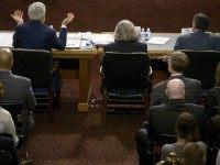 US Secretary of Energy Ernest Moniz (C) and US Secretary of the Treasury Jacob Lew listen while US Secretary of State John Kerry (L) speaks during a hearing of the Senate Foreign Relations Committee on Capitol Hill July 23, 2015 in Washington, DC. US Secretary of State John Kerry, US Secretary of Energy Ernest Moniz and US Secretary of the Treasury Jacob Lew appeared before the committee to defend the Obama administrations proposed deal with Iran over the county's nuclear program. AFP PHOTO/BRENDAN SMIALOWSKI (Photo credit should read