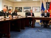 President Barack Obama, right, sits next to Defense Secretary Ash Carter, with other military personnel as they wait to receives an update on the Islamic State group at the Pentagon on Monday, July 6, 2015.