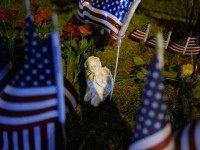 An angel statue sits in a makeshift memorial near the scene of a shooting at a Armed Forces Career Center/National Guard recruitment office on July 16, 2015 in Chattanooga, Tennessee. According to reports, Mohammod Youssuf Abdulazeez, 24, opened fire on a military recruiting station at a strip mall and then killed four U.S. Marines at an operational support center operated by the U.S. Navy at another location more than seven miles away, where the gunmen himself was also killed.