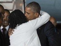 President Barack Obama is greeted by his half-sister, Auma Obama, upon his arrival at Kenyatta International Airport in Nairobi on July 24, 2015. US President Barack Obama arrived in Kenya late today, his first visit to the country of his father's birth since his election as president. AFP PHOTO / SAUL LOEB