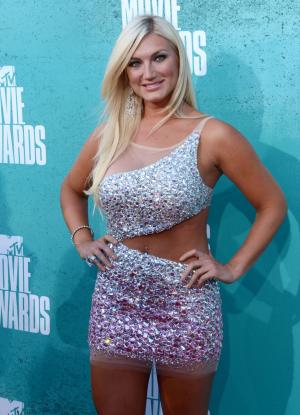 Brooke Hogan uses poetry to defend father Hulk against racism allegations