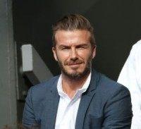 David Beckham catches tennis ball during Wimbledon match