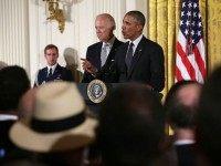 U.S. President Barack Obama (R) speaks as Vice President Joseph Biden (L) listens during a East Room Reception July 20, 2015 at the White House in Washington, DC. President Obama held a reception to mark the 25th anniversary of the Americans with Disabilities Act. (Photo by