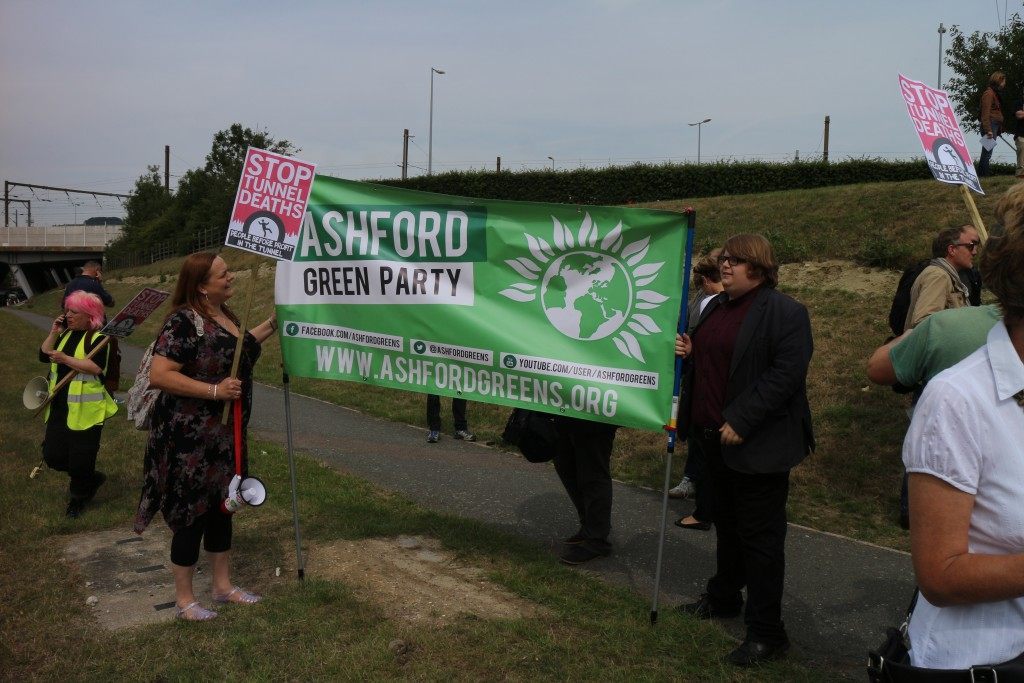 A Green Party banner unfurled by pro-immigrant demonstrators