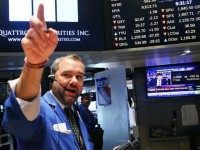 : A trader works on the floor of the New York Stock Exchange (NYSE) on August 24, 2015 in New York City. As the global economy continues to react from events in China, markets dropped significantly around the world on Monday. The Dow Jones industrial average briefly dropped over 1000 points in morning trading. (Photo by