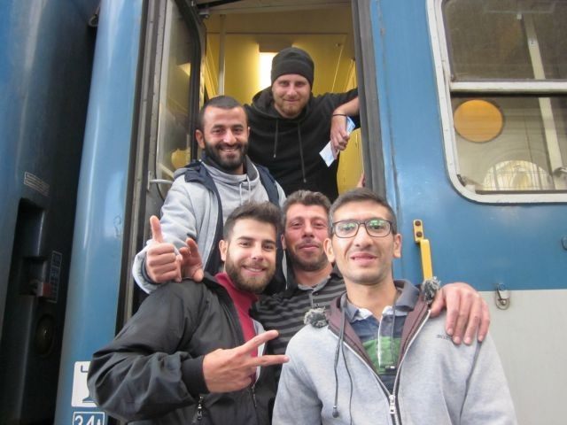 Caption: The Aleppo boys board their train for Germany in Budapest.