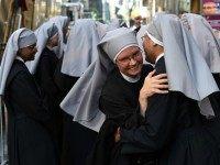 Nuns from the Little Sisters of the Poor gather in New York September 24, 2015 as Pope Francis now heads to New York City. He is set to arrive and hold a prayer service at St. Patricks Cathedral. AFP PHOTO / TIMOTHY A. CLARY (Photo credit should read