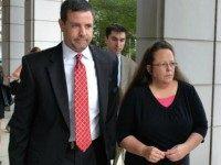 Rowan County Clerk Kim Davis, right, walks with her attorney Roger Gannam into the United States District Court for the Eastern District of Kentucky in July. The Rowan County, Ky., clerk's office turned away gay couples who sought marriage licenses on Thursday, defying a federal judge's order that said deeply held Christian beliefs don't excuse officials from following the law.