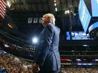 epublican presidential candidate Donald Trump waves to the audience during a campaign rally at the American Airlines Center on September 14, 2015 in Dallas, Texas. More than 20,000 tickets have been distributed for the event. (Photo by