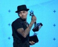 Chris Brown brings daughter Royalty to charity event