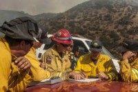 Four firefighters injured as California battles two growing fires