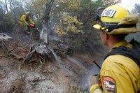 California fire destroys at least 585 homes; schools closed