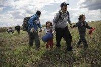 Migrants in Hungary break through police lines over camp conditions