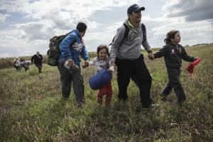 Migrants in Hungary break through police lines over camp conditions
