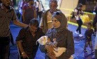 Budapest train station reopens to migrants after two-day conflict