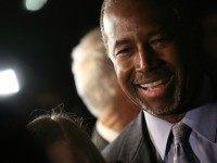 Republican presidential candidate Dr. Ben Carson greets supporters after delivering brief remarks at the King Street Retail Walk October 16, 2015 in Alexandria, Virginia. Carson discussed threats facing the United States during his remarks.