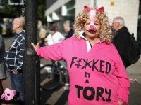 MANCHESTER, ENGLAND - OCTOBER 04: People take part in an anti-austerity protest during the first day of the Conservative Party Autumn Conference 2015 on October 4, 2015 in Manchester, England.