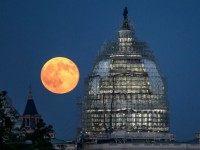 In this handout provided by the National Aeronautics and Space Administration (NASA), a second full moon for the month of July rises behind the dome of the U.S. Capitol on July 31, 2015 in Washington, DC. In recent years, people have been using the name Blue Moon for the second of two full moons in a single calendar month. An older definition of Blue Moon is that it is the third of four full moons in a single season. (Photo by