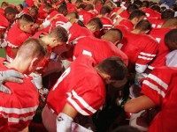 Football prayer (Joe Raedle / Hulton Archive / Getty)