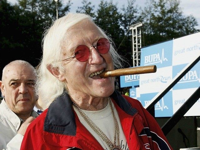 NEWCASTLE, ENGLAND - OCTOBER 1: Sir Jimmy Saville prepares for The Bupa Great North Run on October 1, 2006 in Newcastle, England.