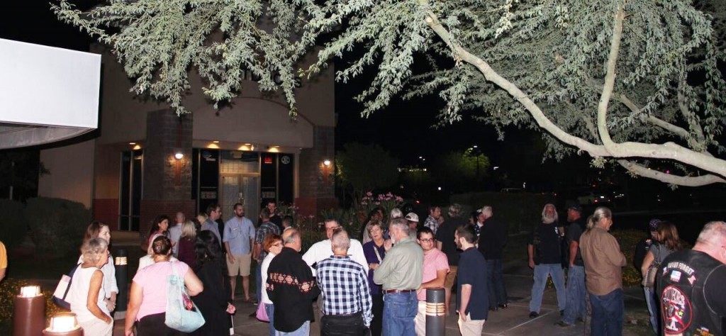 After following police orders to "disperse" attendees gather at safer confines -- the Scottsdale Gun Club. (Photo: Breitbart News)