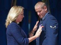 Air Force Airman 1st Class Spencer Stone (R) receives the Purple Heart medal from Secretary of the Air Force Deborah Lee James during an awards ceremony for the three men who helped stop a gunman on a Paris-bound train last month at the Pentagon September 17, 2015 in Arlington, Virginia. Stone received the Airman's Medal and the Purple Heart medal, Army Specialist Alek Skarlatos received the Soldier's Medal and Anthony Sadler received the Defense Department Medal for Valor. The three men helped overpower gunman Ayoub El-Khazzani, 25, after he opened fire on a Thalys train traveling from Amsterdam to Paris on August 21.