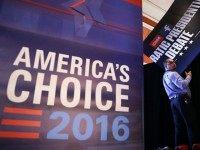 A worker holds a fallen sign in the spin room before the Democratic presidential debate sponsored by CNN and Facebook at Wynn Las Vegas on October 13, 2015 in Las Vegas, Nevada. Five Democratic presidential candidates are scheduled to participate in the party's first presidential debate. (Photo by
