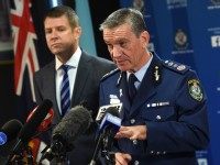 New South Wales police commissioner Andrew Scipione (R) and state Premier Mike Baird speak to the media in Sydney on October 3, 2015, the day after an attack in Sydney in which a 15-year-old gunman shot dead a civilian police employee.