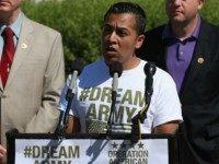 Cesar Vargas (C), co-director of the DREAM Action Coalition speaks while flanked by Rep. Bill Foster (D-IL) (L) and Rep. Jared Polis (D-CO) during a news conference on Capitol Hill July 25, 2014 in Washington, DC. The members of Congress called on the Defense Department to allow certain undocumented individuals who were brought to the United States as children, to serve in the military. (Photo by )