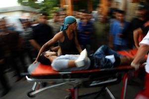 Deadly confrontations scar Gaza, West Bank on 'day of rage', Israel uses metal detectors