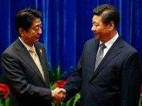 BEIJING, CHINA - NOVEMBER 10: China's President Xi Jinping (R) shakes hands with Japan's Prime Minister Shinzo Abe, during their meeting at the Great Hall of the People, on the sidelines of the Asia Pacific Economic Cooperation (APEC) meetings, November 10, 2014 in Beijing, China. APEC Economic Leaders' Meetings and APEC summit is being held at Beijing's outskirt Yanqi Lake. (Photo by Kim Kyung-Hoon-Pool/Getty Images)