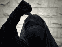 A Bahraini Shiite Muslim woman wearing the niqab shouts anti-government slogans during a demonstration in solidarity with human rights activists and political prisoners in the village of Sanabis, west of Manama, on January 6, 2013.